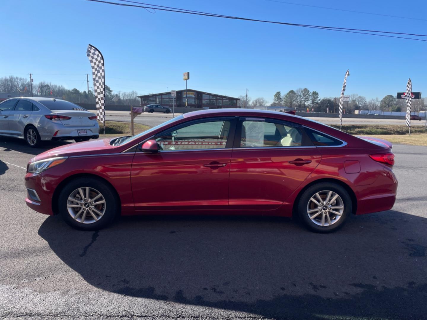 2016 Maroon Hyundai Sonata (5NPE24AF6GH) with an 4-Cyl, 2.4 Liter engine, Auto, 6-Spd w/Shiftronic and Drive Mode Select transmission, located at 8008 Warden Rd, Sherwood, AR, 72120, (501) 801-6100, 34.830078, -92.186684 - Photo#4